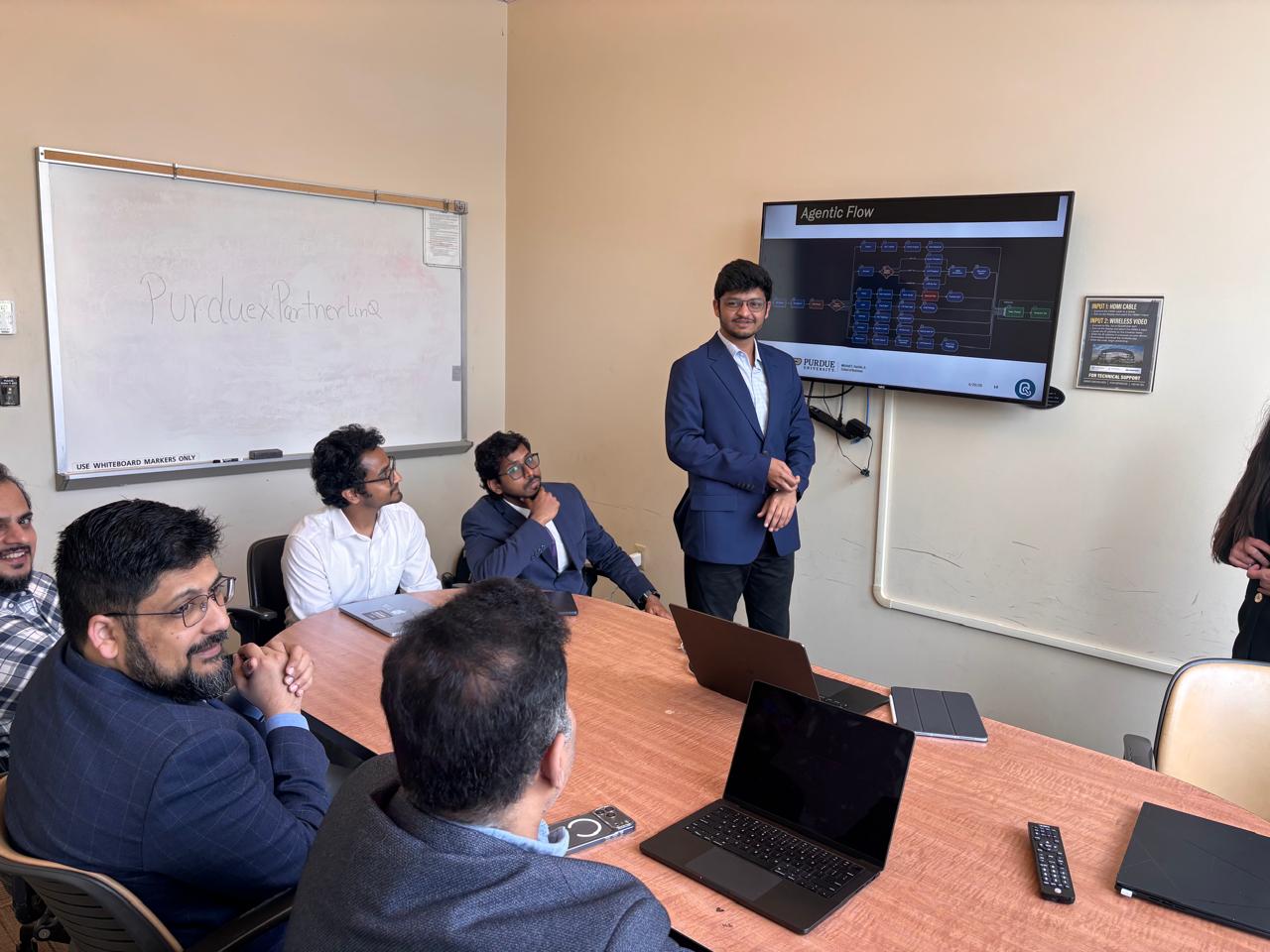 Presenting an agentic flow diagram to a room at PartnerLinQ